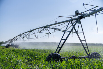 Agricultural pivot irrigation system on a corn field