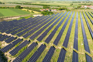 Aerial view of village next to solar power station