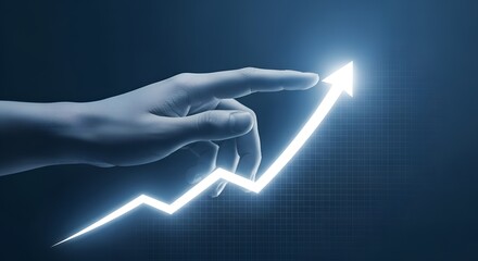 Human hand pointing to illuminated rising arrow representing business growth and financial success