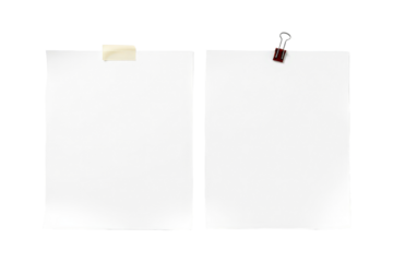Two blank white paper sheets are attached to a wall, ready for messages or announcements.