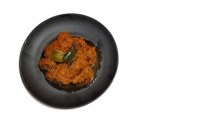 Beef Toppa Lada served in a black plate. Popular Indonesian food from Makassar, South Sulawesi