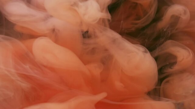 Cloud flow. Paint water. Defocused orange purple colorful ethereal wet splash liquid spreading on abstract dark black art background.