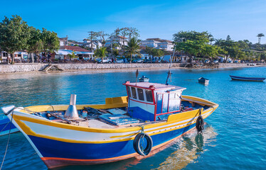 Fishing boat in the The idyllic Praia do Canto, Canto Beach, with its clear, calm waters and its...
