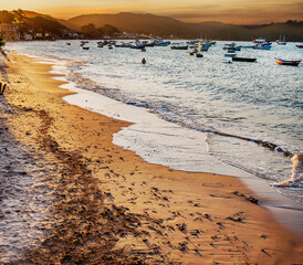 The idyllic Praia do Canto, Canto Beach, with its clear, calm waters and its fishing and tourist...