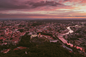 Scenic aerial view of Vilnius Old Town and Neris river at nightfall. Sunset landscape.