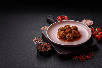 Meat, meatballs in tomato sauce, Italian food, beef or pork with salt . Meatballs with tomatoes