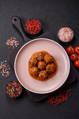 Meat, meatballs in tomato sauce, Italian food, beef or pork with salt . Meatballs with tomatoes