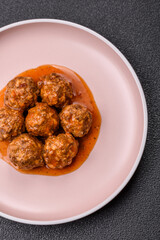 Meat, meatballs in tomato sauce, Italian food, beef or pork with salt . Meatballs with tomatoes