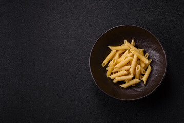 Penne pasta cooked with cheese, salt and spices. Italian food penne pasta