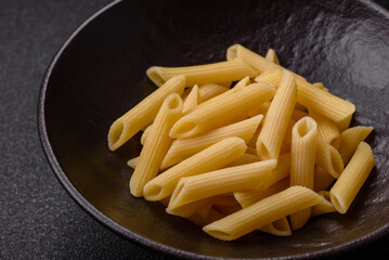 Penne pasta cooked with cheese, salt and spices. Italian food penne pasta