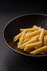 Penne pasta cooked with cheese, salt and spices. Italian food penne pasta