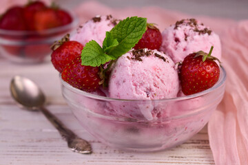 Yummy strawberry ice cream on white marble table
