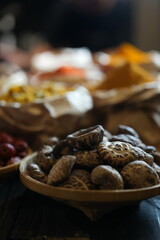 Colorful selection of dried herbs, spices, and natural ingredients in paper bags on rustic market...