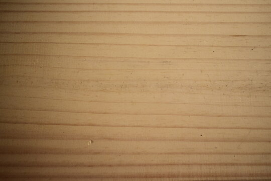 Textura de t&aacute;bua de pinos amarelada com linhas e veios de madeira polida/lixada