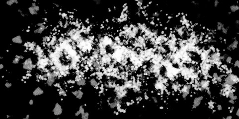 Snowflakes on dark background. white icy snowflakes isolated on black background, natural background. white crystalline powder on a black background. sugar dust. texture, pattern and clipping.