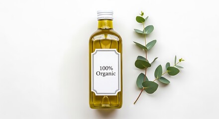 100% organic olive oil bottle with eucalyptus leaves on a white background