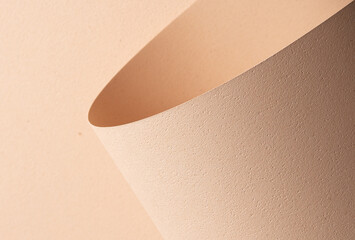 Chic designer paper closeup. Monochrome background in beige and cream color with matte grained