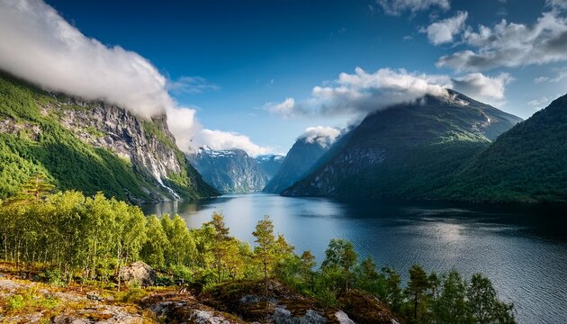 norwegian fjord high mountains and forest clouds over the rocks vacation and travel in summer norway wallpaper postcard background place for mountain hiking travel and vacation