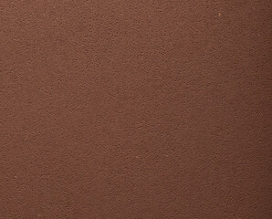Flat designer paper in chocolate brown tones with smooth surface and pitted porous texture. Elegant
