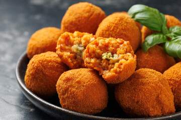 Arancini Rice Balls. Crispy, deep fried rice balls stuffed with mozzarella cheese