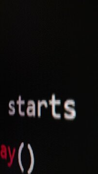Closeup macro shot movement of coding script moving across LED screen with real-time AI-generated typing, showcasing advanced AI learning in optimization, debug and coding for software development.