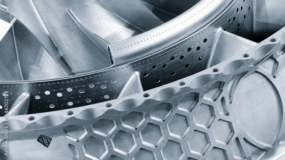 Poster complex metal piece with a pattern created by a 3D printer. The lines are arranged in a spiral pattern, creating a sense of movement and energy. Adaptive technologies concept background