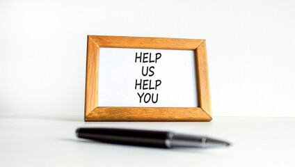 Help you symbol. Concept words phrase Help us help you on beautiful wooden picture frame. Black...