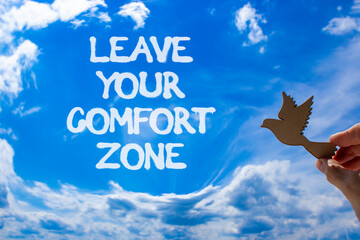 Leave your comfort zone symbol. Concept words Leave your comfort zone on beautiful blue sky....