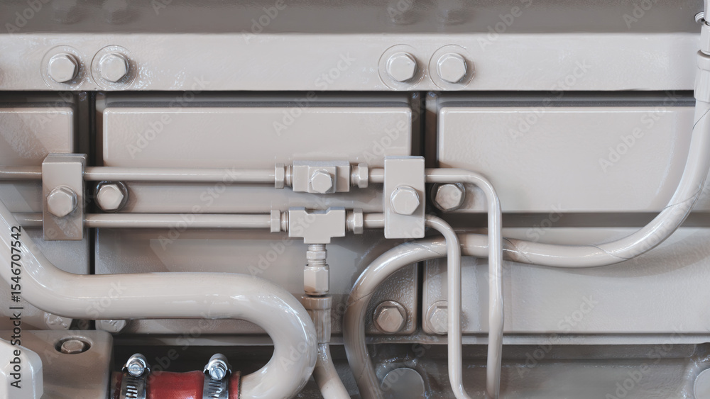 Poster shown is a large engine with many tubes, bolts and various parts. auto service concept background