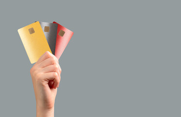 holding a bank card for secure payment at a retail store. Multiple options for transaction,