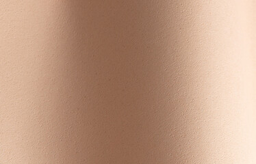 Luxury monochrome paper in warm beige cream tones with soft grainy texture and fine speckled details