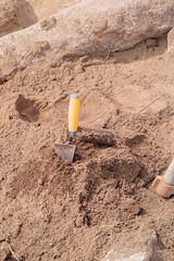 Awaiting Discovery: A Trowel at an Active Excavation.