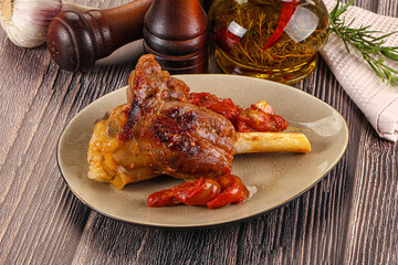 Baked lamb shank with vegetables