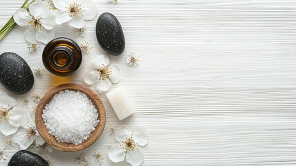 beauty treatment items for spa procedures on white wooden table. massage stones, essential oils and sea salt. copy space
