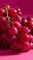 Fototapeta premium A bunch of red grapes with water droplets on them