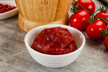 Red tomato paste in the bowl