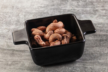 Unpeeled cashew nuts in the bowl
