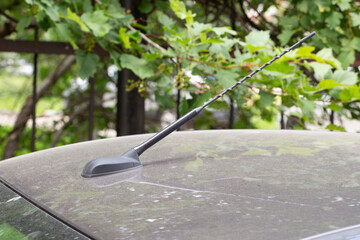 Car antenna on the car roof. Radio antenna.