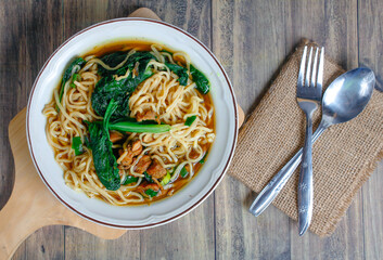 Indonesian street food culinary chicken noodles, noodles served with a mixture of sweet chicken...