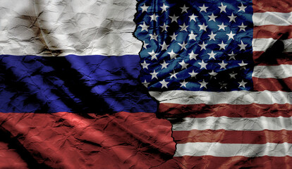 Flags of Russia and United States on crumpled and cracked paper. Concept of conflict between...