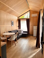 Modern construction of recreation centers. Barnhouse for tourists. Eco-recreation center in Scandinavian style. interior of cottages for country holidays.modern glamping