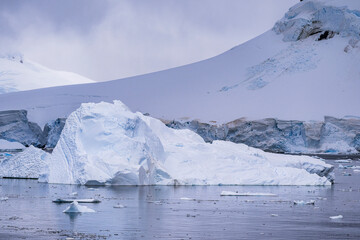 Beautiful paradise harbor in Antarctica under overcast sky