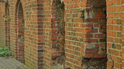 Old Military Fortifications with Ruined Historical Red Brick Wall