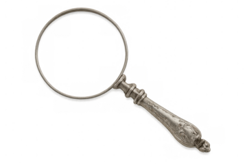 Vintage silver-handled magnifying glass gleaming against transparent backdrop, highlighting intricate craftsmanship from bygone era of detailed exploration