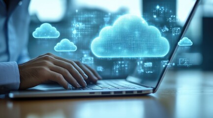 Person using laptop with cloud computing graphic overlay