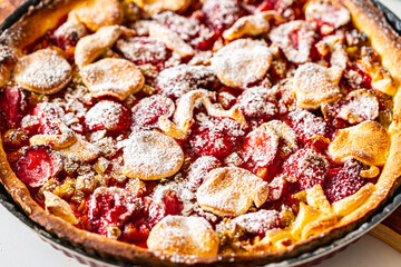 Rhubarb and strawberry tart with mint and sugar. Background with pie texture. Close-up, top view.