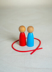 Two figures of human opponents are locked together in a red circle. Working in a team. Conflict...