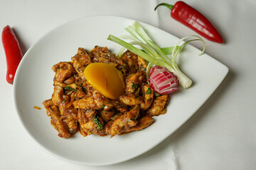 Delicious Spicy Chicken Stir Fry with Mango and Radish Garnish