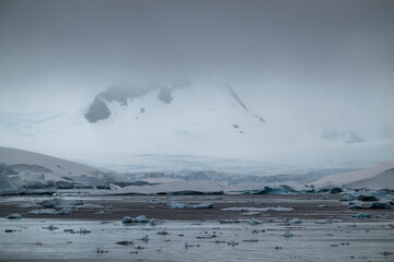 Beautiful paradise harbor in Antarctica under overcast sky