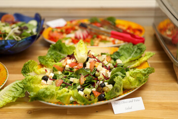 Delicious Juicy Olive and Feta Salad on a Wooden Table